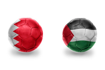 football balls with national flags of palestine and bahrain ,soccer teams. on the white background.