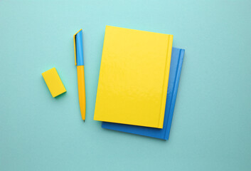 Stationery calculator ruler calculator and school cheat sheets on coloured background. Concept of school and college learning