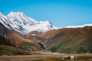 Abano village in Truso Valley, Georgia: stunning alpine scenery with snow-capped peaks, colorful...