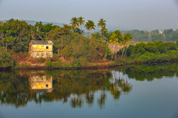 Goa, India. Beautiful landscape view from the moving train crossing the river.