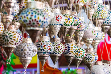 Arambol, Goa, India. Street shop with many traditional colorful handmade indian lamps and lanterns for sale. Popular souvenirs to buy in India.