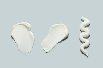 smears of cosmetic product on a blue background