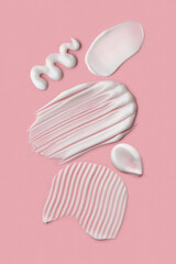 smears of cosmetic product on pink background