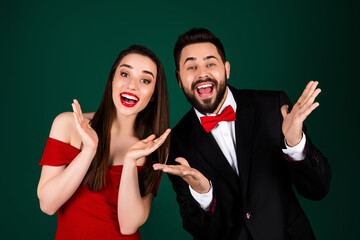 Photo of stunning young girl guy couple excited impressed reaction wear trendy fancy classy outfit isolated on green color background