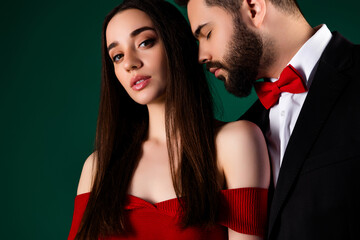 Photo of attractive young man woman couple tempting feelings dressed stylish fancy clothes isolated on green color background