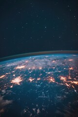 A view of the Earth from space at night, showing city lights and stars