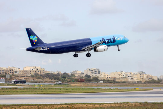Luqa, Malta - November 7, 2024: Azul Cargo Airbus A321-231(P2F) (REG: OE-ICC) departing in the rain to Espargos on delivery. To be registered as PS-AJB.