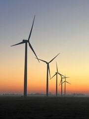 Wind turbines in a field in Indiana at sunrise in autumn.