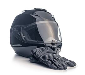 Naklejka premium Black motorcycle helmet and leather gloves isolated on white background.