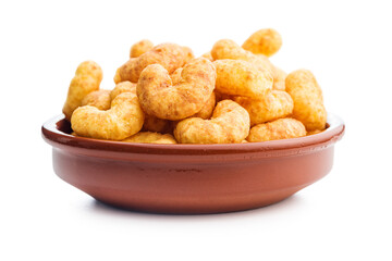 Puffed crispy Peanut flips in bowl isolated on white background.