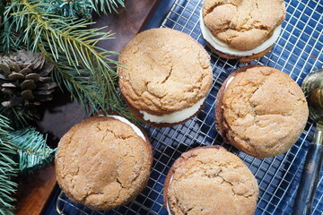 Homemade gingerbread whoopie pies with cream cheese icing.  Best dessert or baked goods for holiday parties or when your feeling cozy.