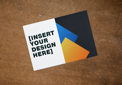 PSD template mockup of Blank A3 canvas Resting on a Textured Brown Surface. Overhead view.