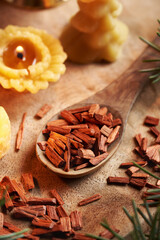 Pieces of red sandalwood on a wooden spoon, close up