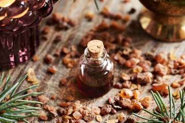 Myrrh essential oil in a glass bottle
