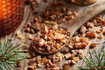 Myrrh resin on a spoon  - ingredient for essential oils production