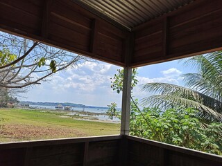 Cozy Cabin Interior with Lake Peten Itza View in El Remate, Peten, Guatemala