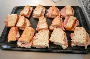 Sandwiches on the table. Fresh sandwiches with spread, cheese and salami.