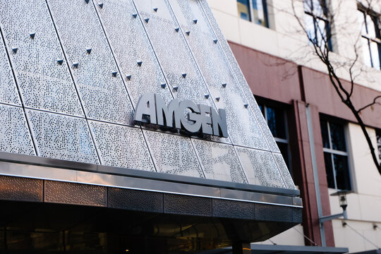 Cambridge, USA - 6 November 2024. close-up view of the Amgen building facade with logo. innovation in the biotech industry