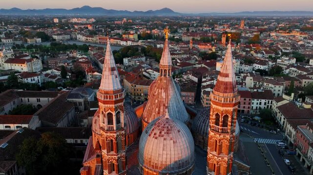travel in Padova, Italy, drone flying around Basilica of Saint Anthony of Padua in morning light, establishing shot of the Italian city of Padova, tourism in Veneto, Italy