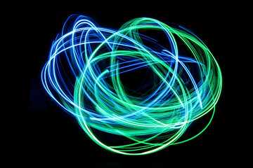 A dynamic neon wireframe globe with glowing blue and green light trails set against a black background.