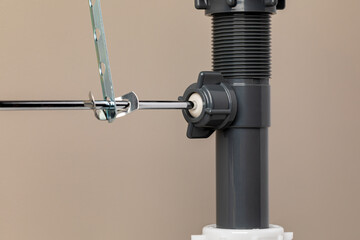 Sink drain stopper assembly. Plumbing installation, home maintenance and repair concept.
