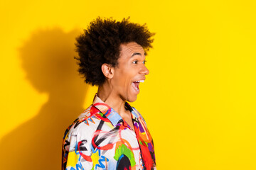 Profile photo of nice young man look empty space wear shirt isolated on bright yellow color background