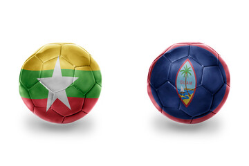 football balls with national flags of guam and myanmar ,soccer teams. on the white background.