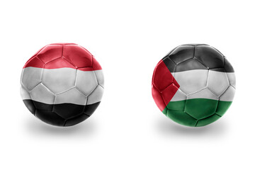 Obraz premium football balls with national flags of palestine and yemen ,soccer teams. on the white background.