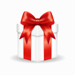 White gift box with red bow on white background.