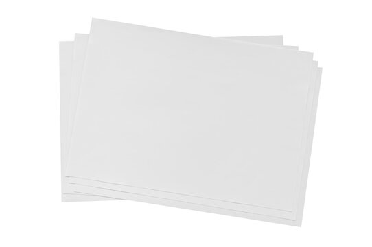 A stack of blank sheets of paper ready for various art and writing projects in a minimalist workspace environment. Isolated