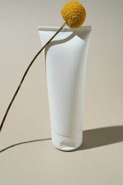 Minimalist hand cream tube with decorative flower