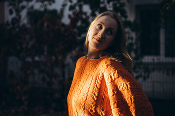 Cozy Autumn Vibes with Woman in Knitted Orange Sweater