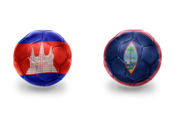 football balls with national flags of guam and cambodia,soccer teams. on the white background.