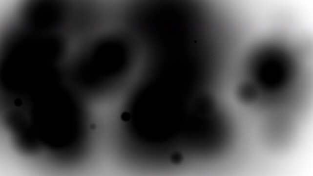 Abstract black and white blurred shapes resembling smoke or nebulae. Ideal for backgrounds, design concepts, and artistic projects. Atmospheric and versatile.