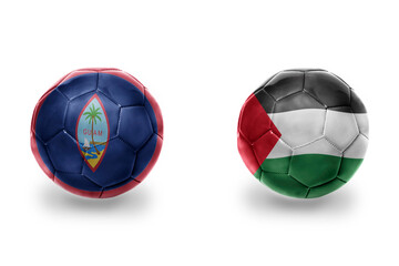 football balls with national flags of palestine and guam ,soccer teams. on the white background.