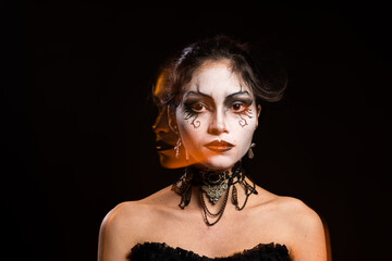 Enigmatic Gothic Woman with Dramatic Makeup and Reflection