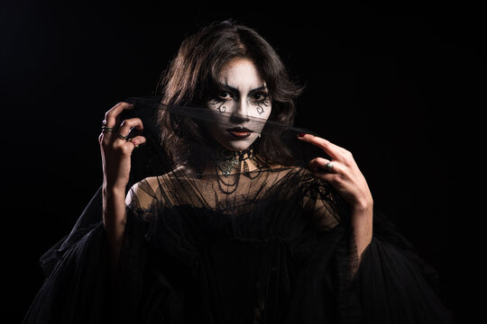 Mysterious Gothic Woman with Dramatic Makeup and Veil