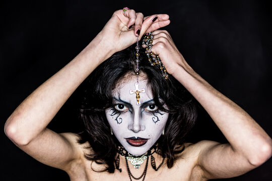 Mysterious gothic woman with dramatic makeup and jewelry