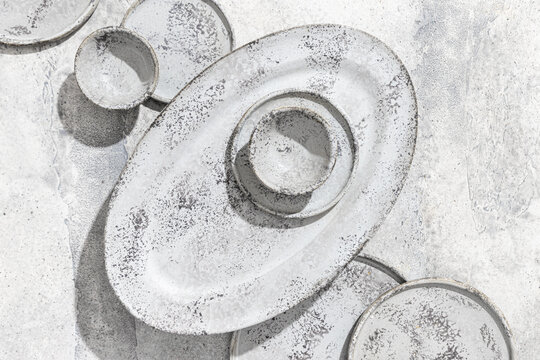 Top view of textured ceramic plates and bowls composition