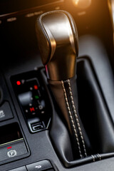 Inside the car.Gear shift handle in a modern car.Vehicle interior.Dashboard, inner workings of a car.