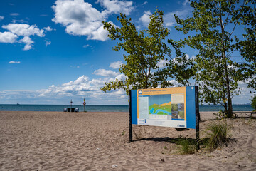 Fototapeta premium Hanlan's Point Beach sign in the Toronto Islands. Toronto, Canada - August 22, 2024.