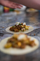 preparing empanadas dumplings for baking