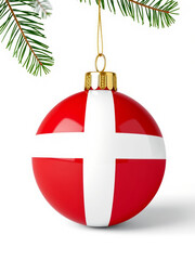 Decorative glass christmas ball hanging on pine tree branch showing denmark flag