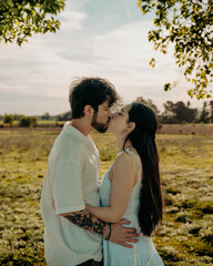 Young couple hugging celebrating Valentine's Day in the countryside