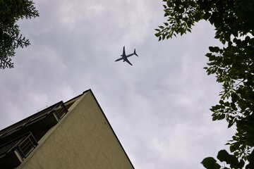 Airplane flying above suburbs