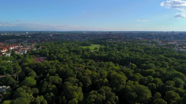 Aerial view of English Garden in Germany, Munich and Monopteros. Lookout point and round temple in English Garden. Chinesischen Turm top view in summer. Luftaufnahme des Englischen Gartens. 