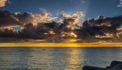 Colorful cloudy sundown scene in Sunset Beach, Chatan Okinawa, Japan
