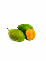 Fresh green mango with cut in half on isolated white background 