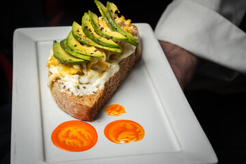 sandwich with salmon and cheese egg and avocado