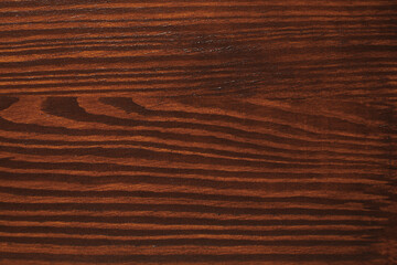Texture of wooden surface after applying walnut wood stain as background, top view